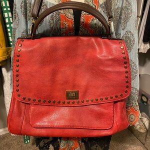 Beautiful deep red purse can be carried as a shoulder bag or hand bag.